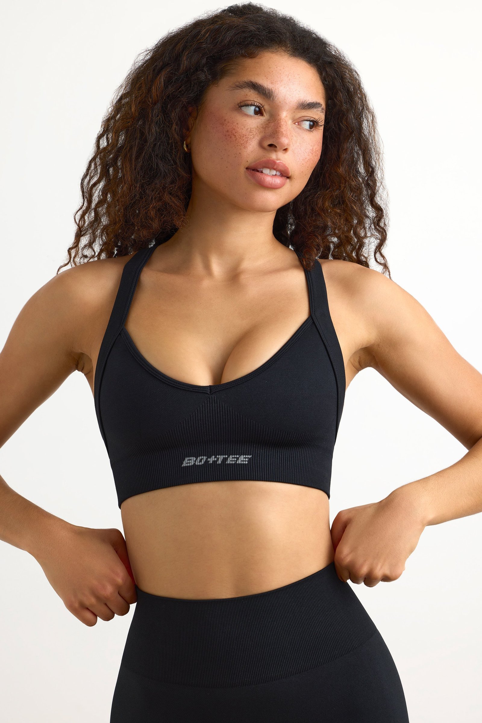 Super Sculpt Seamless Cross-Back Sports Bra in Black - Image 6
